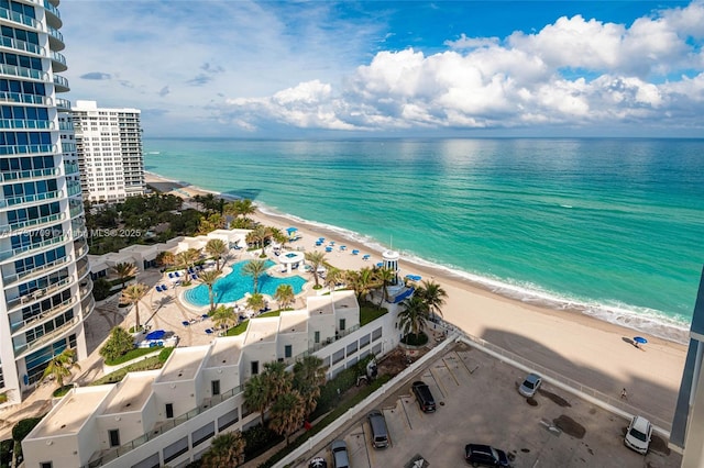 birds eye view of property featuring a water view and a view of the beach