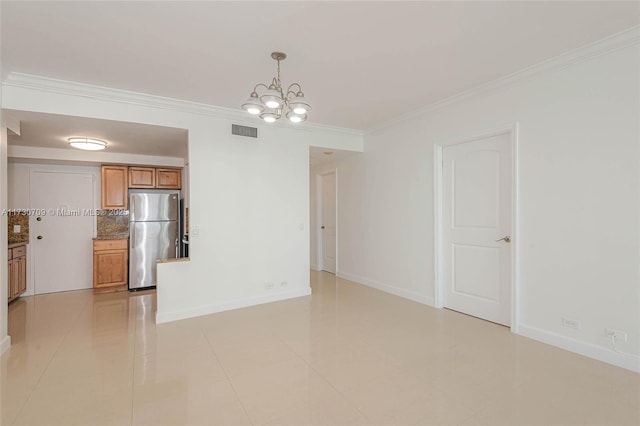 interior space featuring crown molding, an inviting chandelier, and light tile patterned floors