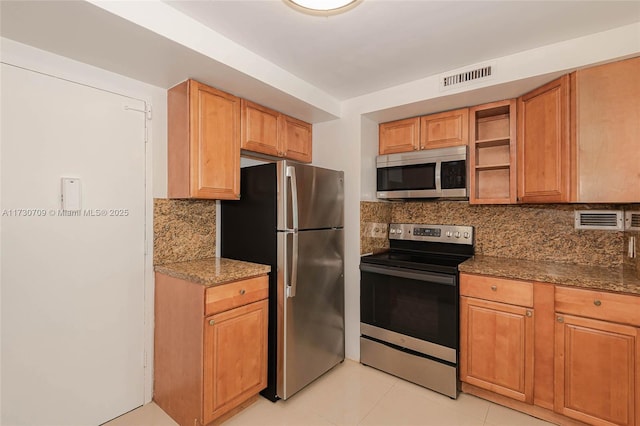 kitchen featuring backsplash, dark stone counters, light tile patterned floors, and stainless steel appliances