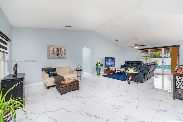 living room with ceiling fan and lofted ceiling