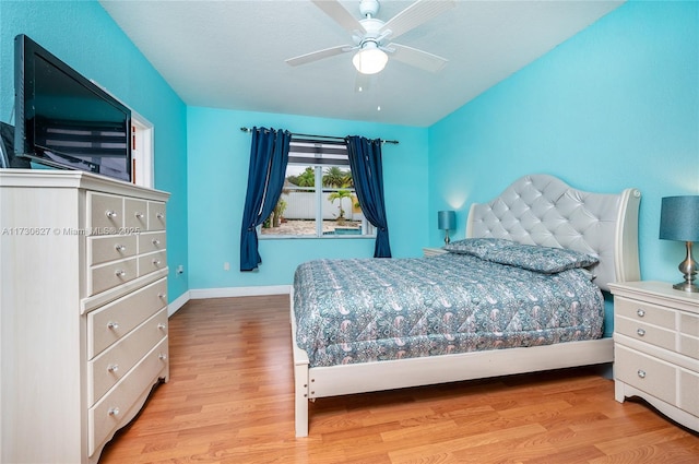 bedroom with ceiling fan and light hardwood / wood-style flooring