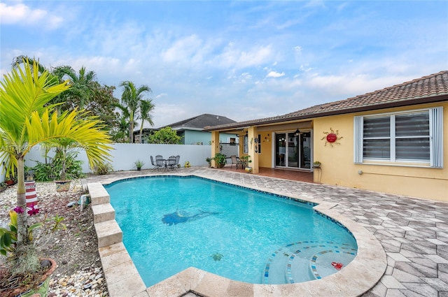 view of swimming pool with a patio