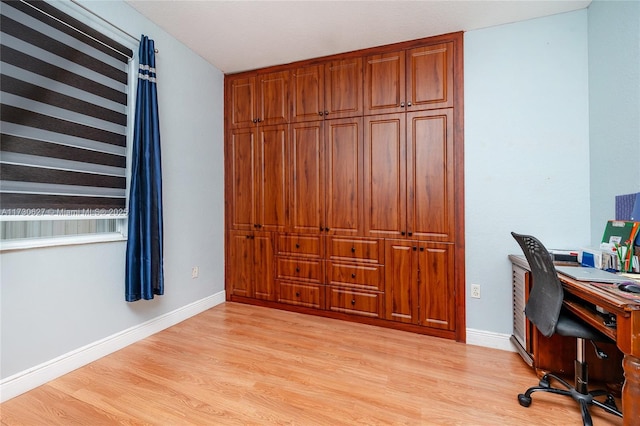 office space with light hardwood / wood-style flooring