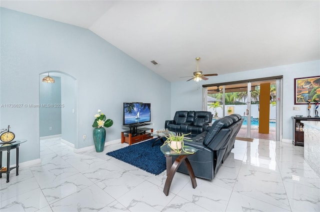 living room with ceiling fan and lofted ceiling