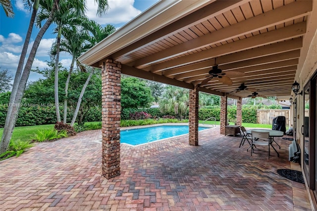 view of swimming pool with ceiling fan and a patio area