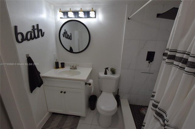 bathroom featuring vanity, toilet, and curtained shower