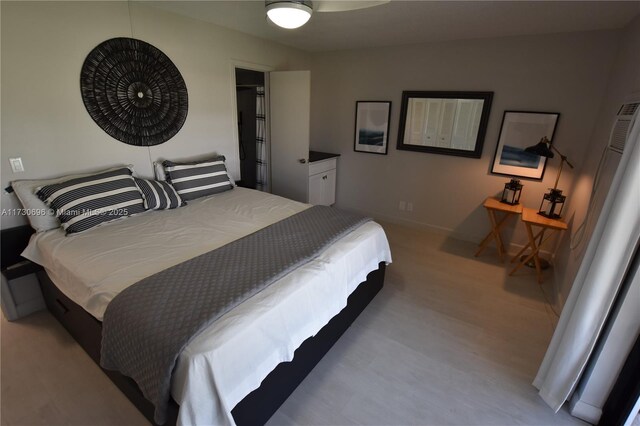 bedroom with light wood-type flooring