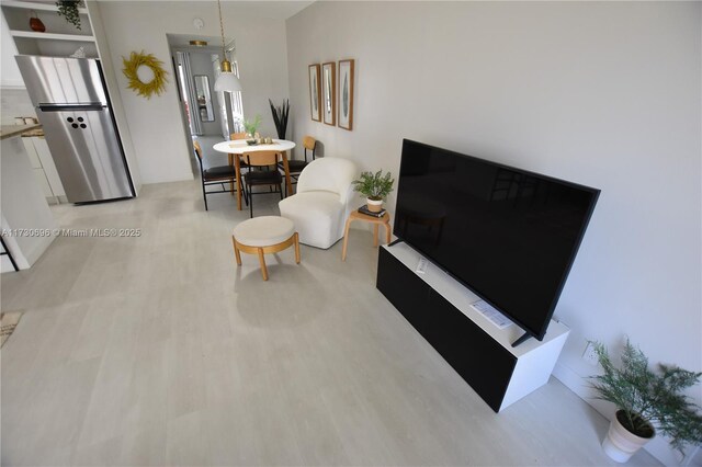 living room with light hardwood / wood-style flooring