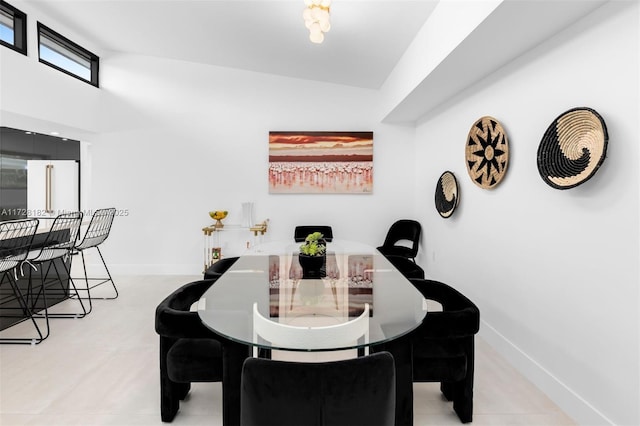 dining room with lofted ceiling