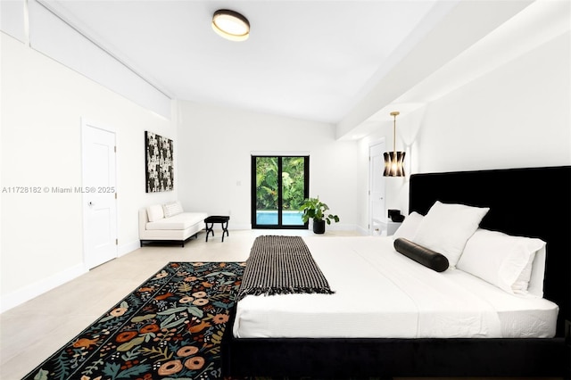 bedroom featuring access to exterior and lofted ceiling