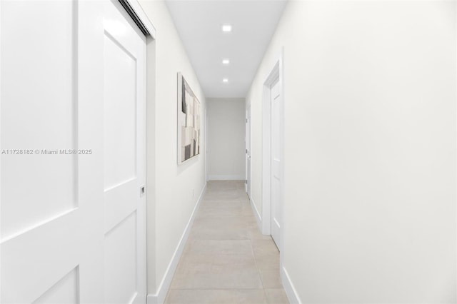 corridor featuring light tile patterned flooring