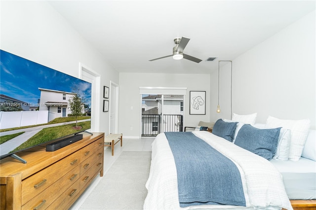 bedroom with ceiling fan and access to exterior