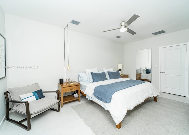 bedroom featuring ceiling fan and light tile patterned floors