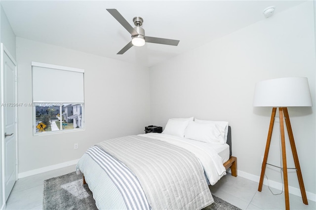 bedroom featuring ceiling fan and light tile patterned flooring