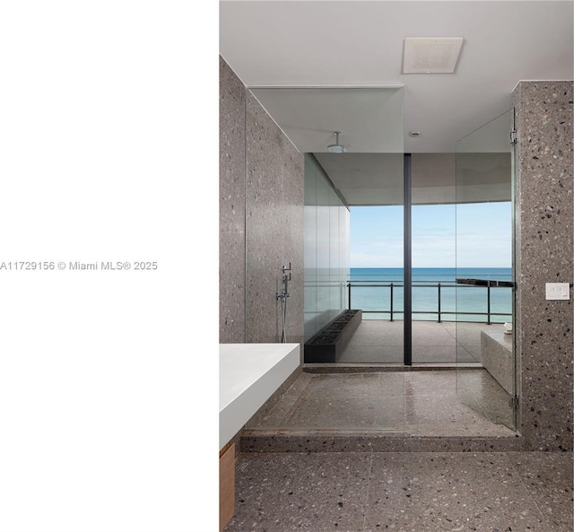 bathroom with a water view