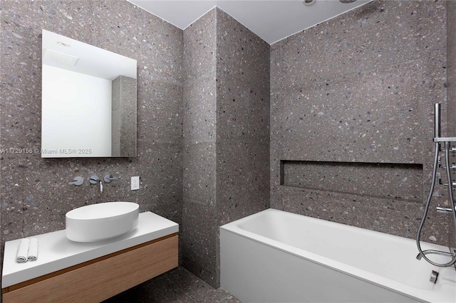 bathroom featuring vanity and a bathing tub