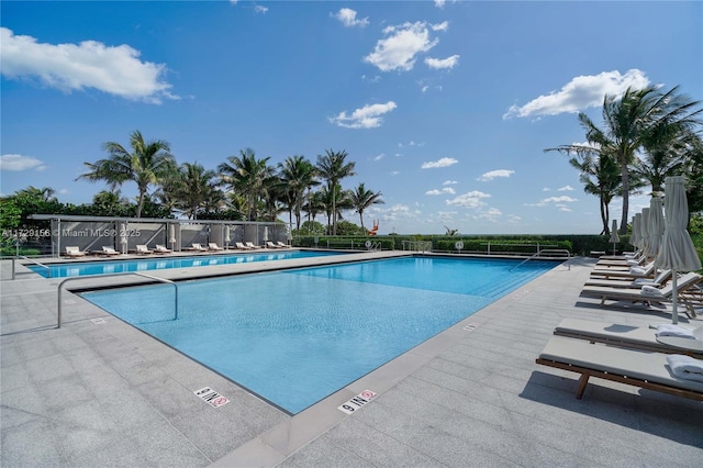 view of swimming pool featuring a patio area