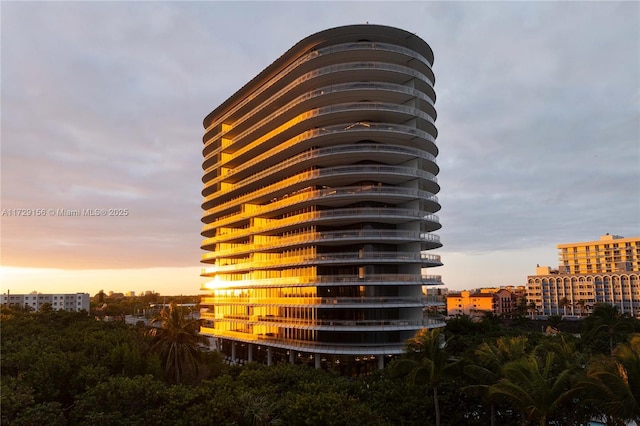 view of outdoor building at dusk