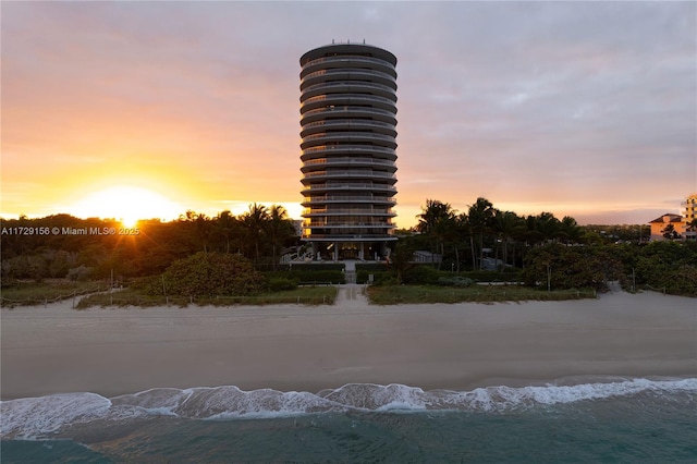 view of outdoor building at dusk