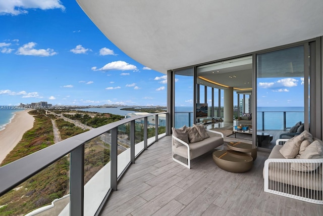 balcony featuring an outdoor hangout area and a water view