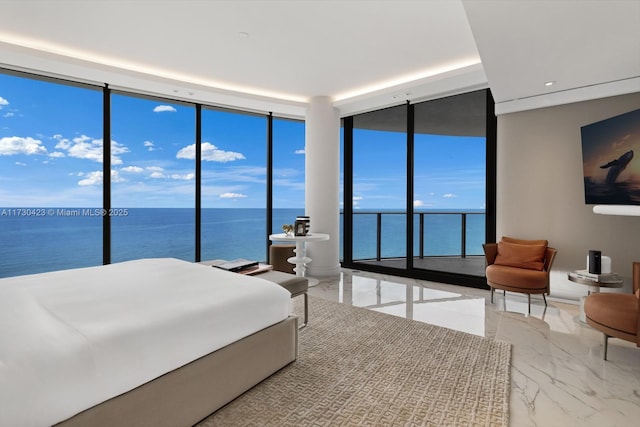 bedroom with a water view, expansive windows, and access to outside