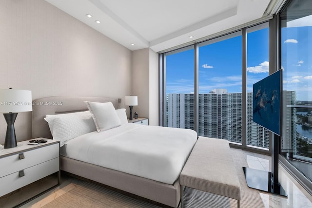 bedroom with floor to ceiling windows