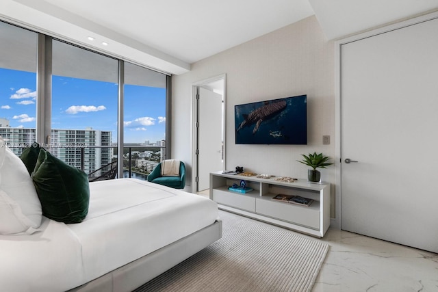 bedroom with floor to ceiling windows