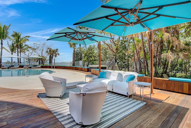 wooden terrace with a fenced in pool