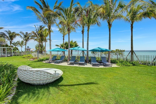 view of yard featuring a gazebo, a patio area, and a water view