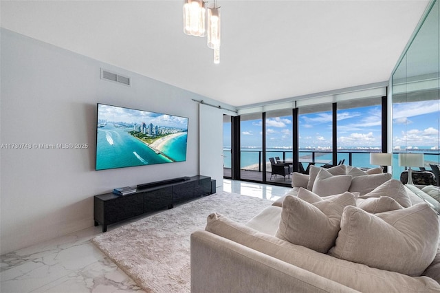 living room featuring floor to ceiling windows