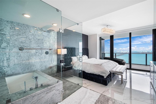 bedroom featuring expansive windows and a water view