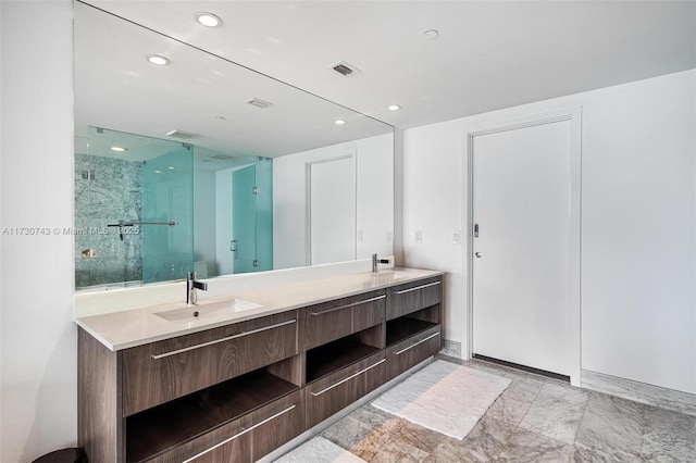 bathroom featuring vanity and an enclosed shower