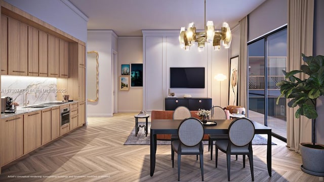 dining room featuring sink, crown molding, light parquet floors, and an inviting chandelier