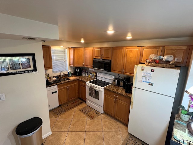 3300 W Rolling Hills Cir Unit 102, Davie, FL 33328 - kitchen with white appliances, light tile patterned floors, brown cabinets, and recessed lighting