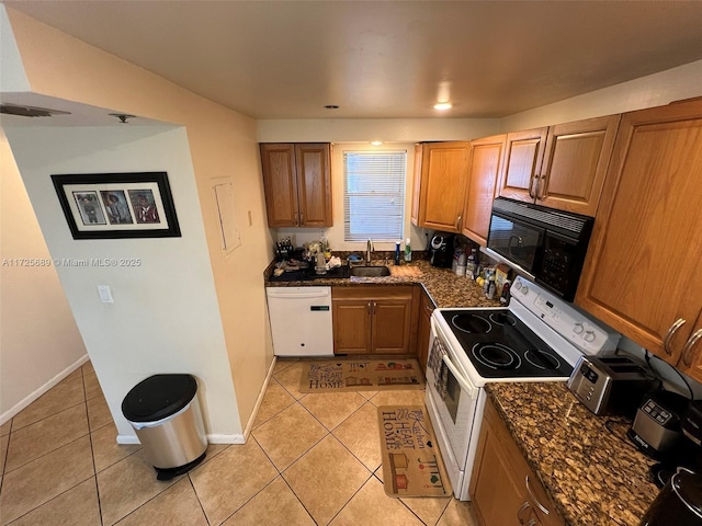 3300 W Rolling Hills Cir Unit 102, Davie, FL 33328 - kitchen featuring white appliances, light tile patterned floors, and dark stone countertops