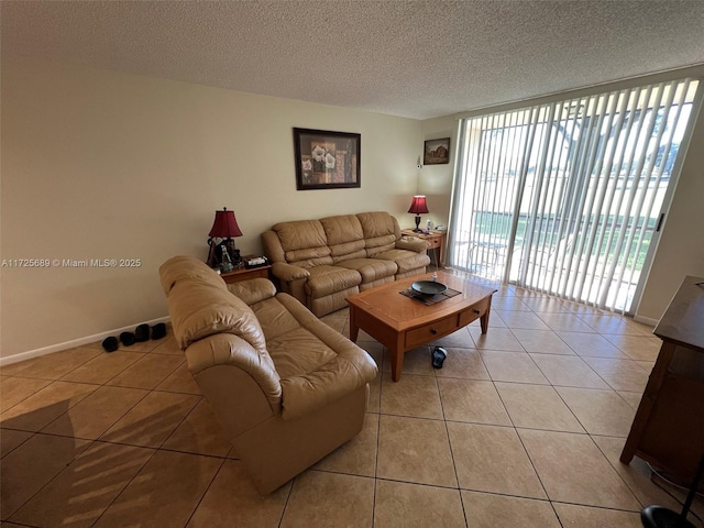 3300 W Rolling Hills Cir Unit 102, Davie, FL 33328 - living area featuring light tile patterned floors and a textured ceiling