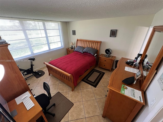 3300 W Rolling Hills Cir Unit 102, Davie, FL 33328 - bedroom featuring a textured ceiling and light tile patterned flooring