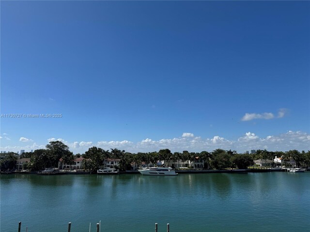 birds eye view of property featuring a view of the beach and a water view