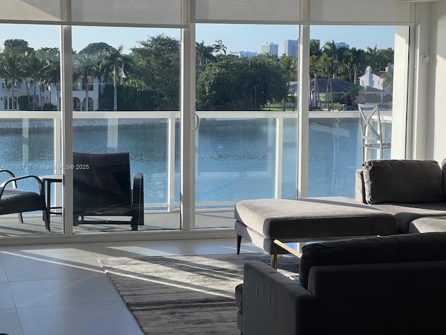 sunroom / solarium with a water view