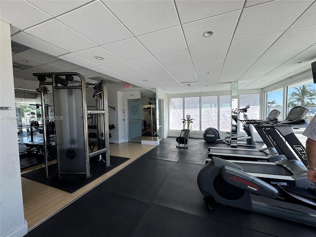 exercise room featuring a drop ceiling