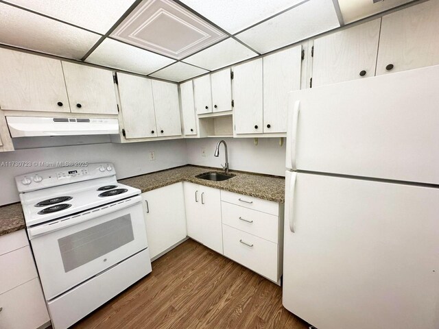 15600 NW 7th Ave Unit 301, Miami, FL 33169 - kitchen with white appliances, white cabinets, a paneled ceiling, dark hardwood / wood-style flooring, and sink