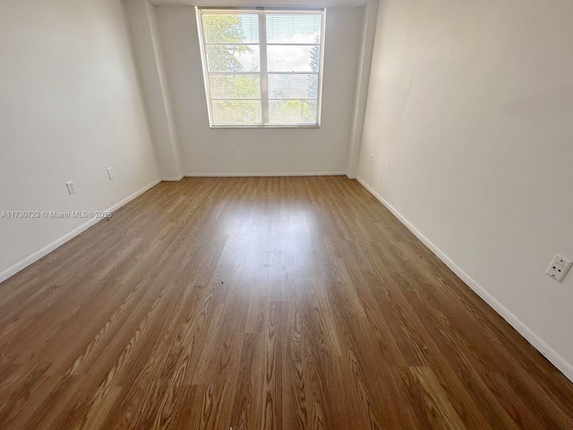 15600 NW 7th Ave Unit 301, Miami, FL 33169 - empty room with hardwood / wood-style flooring