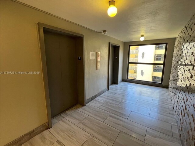 15600 NW 7th Ave Unit 301, Miami, FL 33169 - hall with elevator