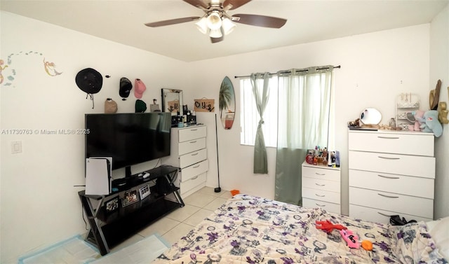 tiled bedroom with ceiling fan