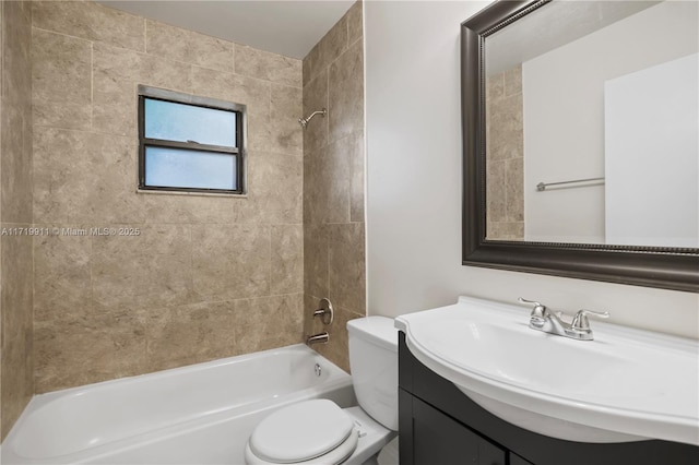 full bathroom with tiled shower / bath combo, vanity, and toilet