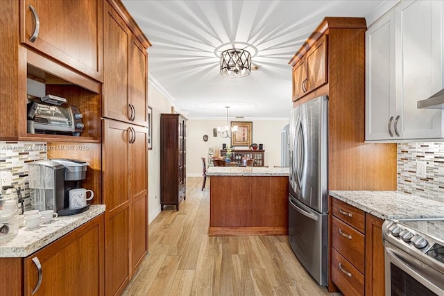 kitchen with stainless steel appliances, tasteful backsplash, hanging light fixtures, ornamental molding, and a chandelier