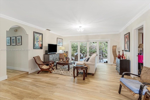 living room featuring crown molding and light wood-type flooring