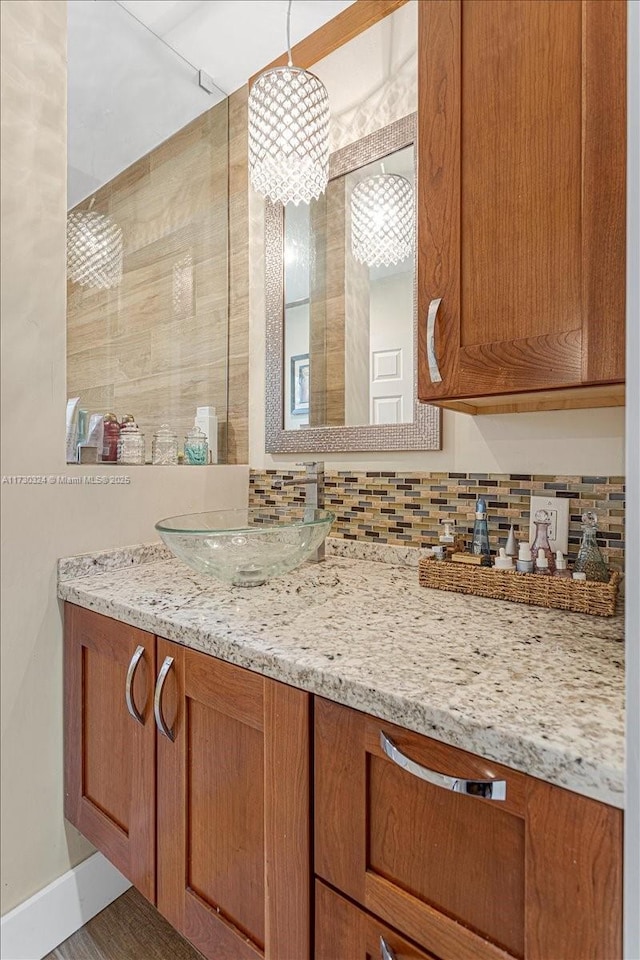 bathroom featuring tasteful backsplash and vanity