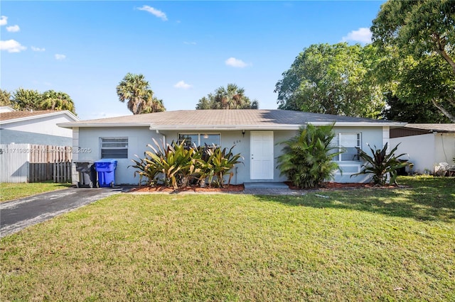 ranch-style home with a front yard