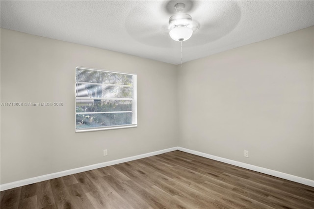 empty room with wood-type flooring, a textured ceiling, and ceiling fan